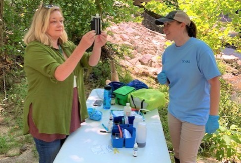 two women measuring water quality 