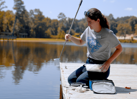 person monitoring lake samples