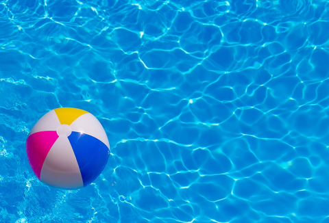 Beachball floating in a clear pool