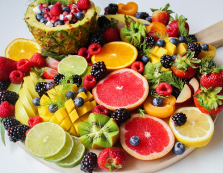 assorted, cut up fruit on a plate