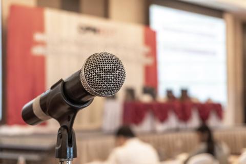 closeup of a microphone in a meeting room