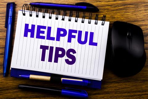 Business concept for Help in FAQ or Advice, written on notebook book note paper on the wood. Blue word letters. Next to mouse.